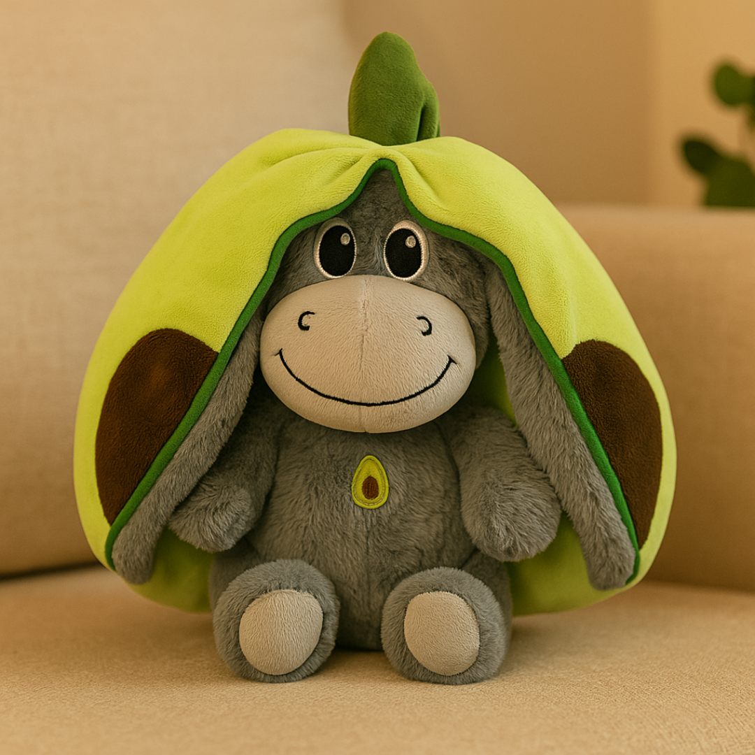 Plush toy donkey inside an avocado shell on a beige background